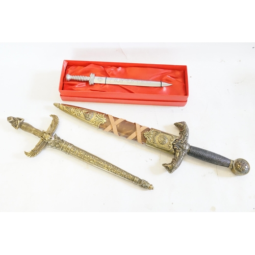 307 - A Reproduction King Arthur Sword, one other of Egyptian inspiration & a Royal Mail Paper Knife.