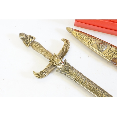 307 - A Reproduction King Arthur Sword, one other of Egyptian inspiration & a Royal Mail Paper Knife.