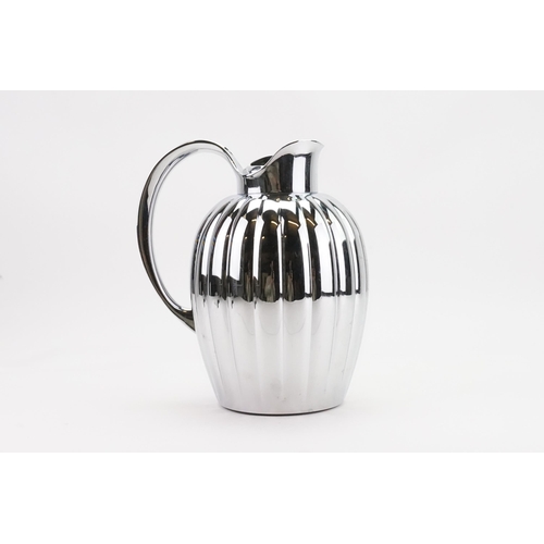 83 - A Sigvard Bernadotte Georg Jensen chrome metal thermos jug.23.5cm high.