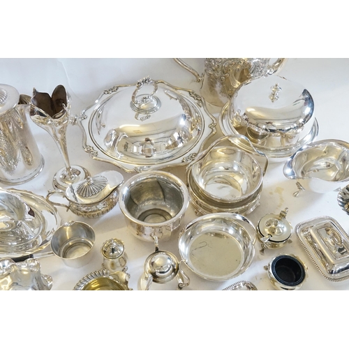 79 - A collection of silver plate, to include teapots, coffee pot, vases, pourer, cruet etc.