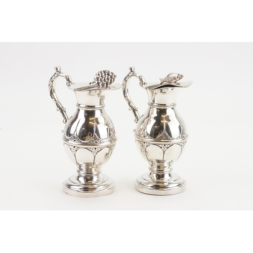 80 - A pair of silver plated miniature claret jugs, Circa 1920's.