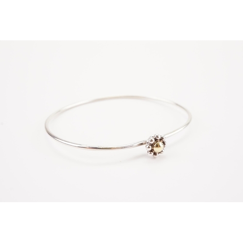 166 - Tiffany & Co. Paloma Picasso gold and silver flower bangle. Weight 5.5g.