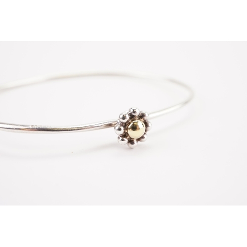 166 - Tiffany & Co. Paloma Picasso gold and silver flower bangle. Weight 5.5g.