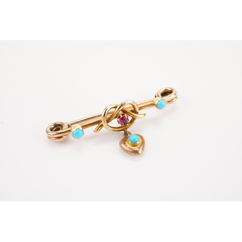 175 - A turquoise and ruby set brooch, in the pretzel and heart design. Weight 3.7g.