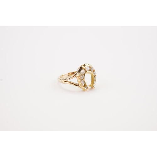 178 - A 9ct gold diamond set horse shoe ring, missing 1 stone. Weight 2.2g. Size G.