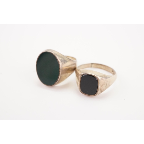 250 - An Onyx Set Silver Signet Ring along with one other Green Signet Ring.