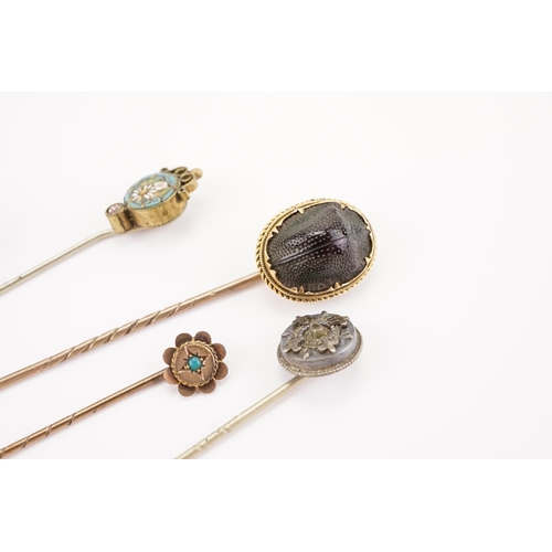 142 - A Collection of interesting Stick Pins to include Scarabs, Mosaic & Turquoise Set.