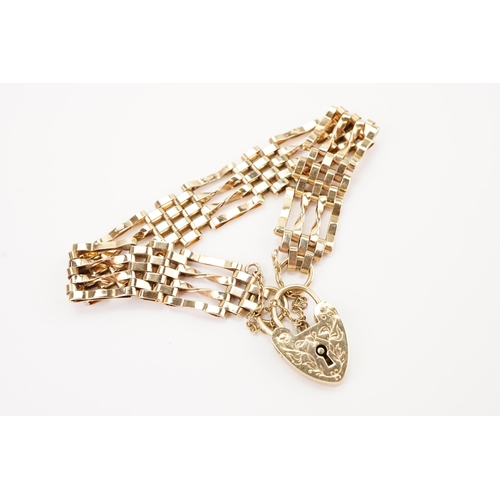 116 - A 9ct Gold Chain Linked Bracelet with Safety Chain & unmarked Love Heart Lock. Weighing: 16.8 grams.