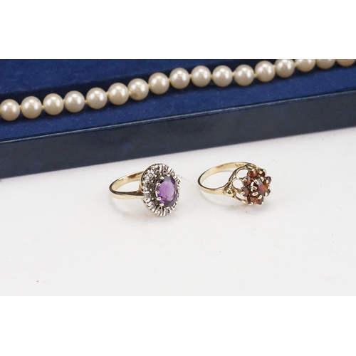 118 - Two 9ct Gold Rings one with a Garnet Setting & one with an Amethyst. Weighing: 5.9 grams. Along with... 