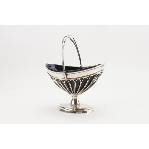 6 - An Unmarked Silver Swing Basket with pierced design with Blue Glass insert. Weighing: 307 grams. (Si... 