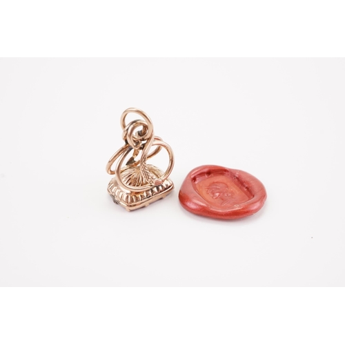 216 - A Georgian Intaglio seal, mounted with a carnelian stone depicting a Roman. Weight 3.5g. Tests as go... 