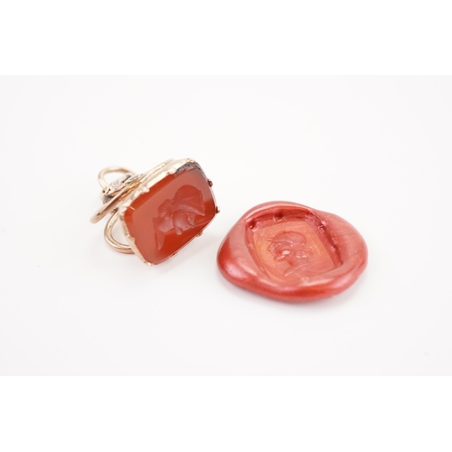 216 - A Georgian Intaglio seal, mounted with a carnelian stone depicting a Roman. Weight 3.5g. Tests as go... 