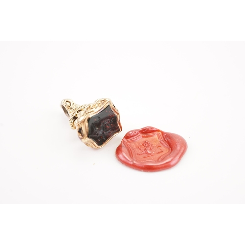 217 - A Victorian Intaglio seal, mounted with a bloodstone depicting a roaring lion. Height 22.8mm. Weight... 