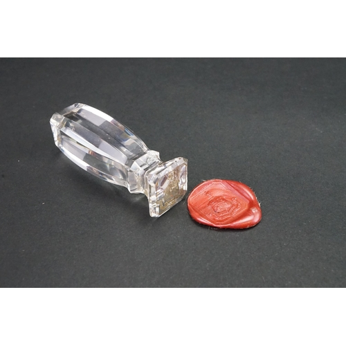 223 - A interesting Victorian rock crystal faceted edged wax seal, depicting a phoenix over shield. Height... 