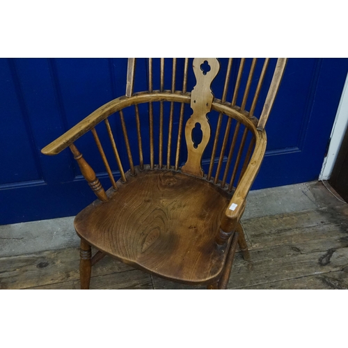 581 - A Victorian Wheel & Splat Back Windsor Chair in Elm & Beech resting on Turned Legs & Cross Stretcher... 