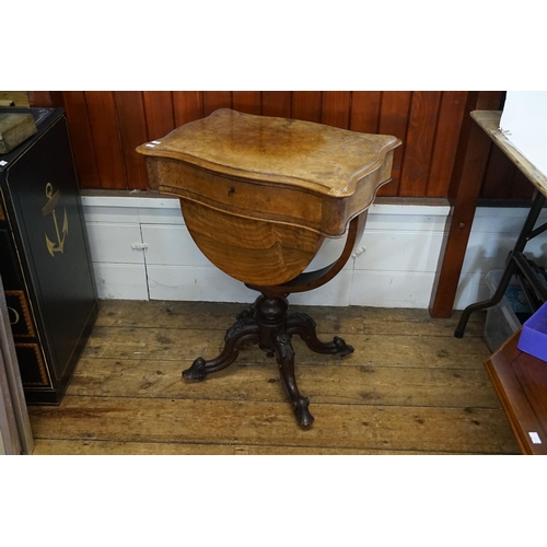 586 - A Victorian Walnut Serpentine Top Single Drawer with a Pull-Out Bottom Needlework Table resting on c... 