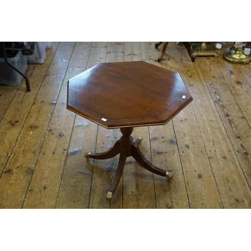 589 - A Reproduction Hexagonal Topped Coffee Table on Reeded Legs & Brass Castors.