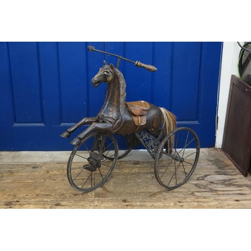 595 - An Indian Tricycle in Wrought Iron with Horse & Leather Saddle. Measuring: 74cms long x 52cms wide x... 