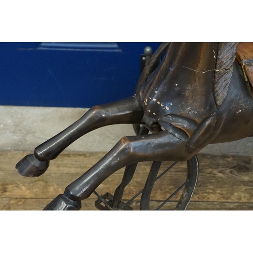 595 - An Indian Tricycle in Wrought Iron with Horse & Leather Saddle. Measuring: 74cms long x 52cms wide x... 