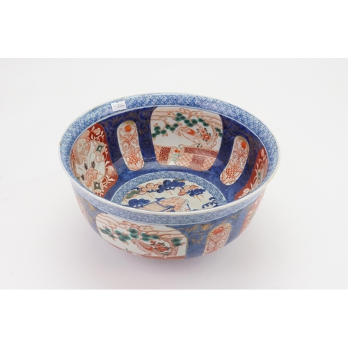 469 - A Japanese Imari Punch Bowl decorated in a Blue ground, Rust Cartouches depicting Birds of Prey in a... 