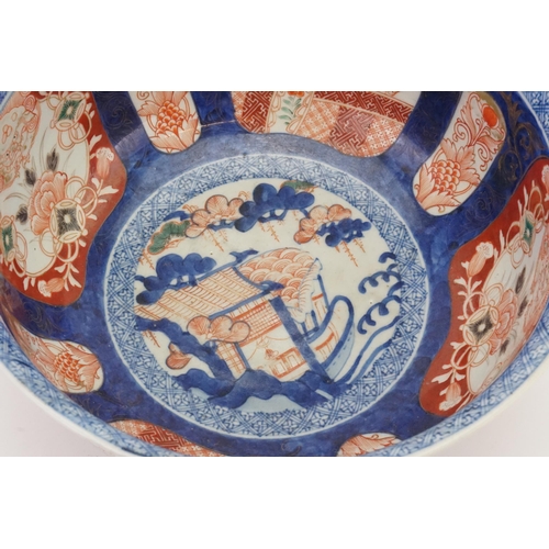 469 - A Japanese Imari Punch Bowl decorated in a Blue ground, Rust Cartouches depicting Birds of Prey in a... 