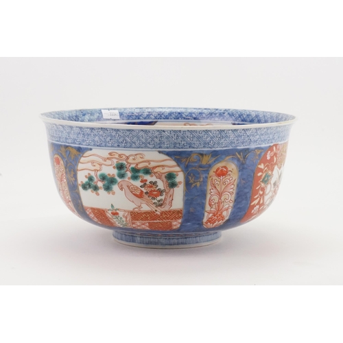 469 - A Japanese Imari Punch Bowl decorated in a Blue ground, Rust Cartouches depicting Birds of Prey in a... 