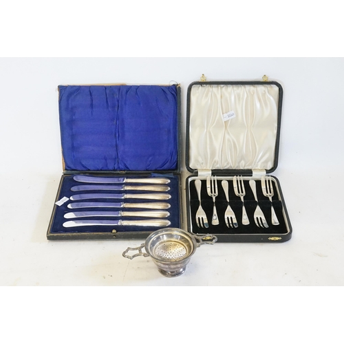 77 - A Set of Six Silver Handled Butter Knives in Case, Six Silver Cake Forks in Case & a Silver Plated T... 