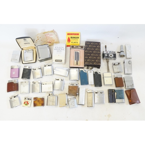 313 - A Large Collection of Cigarette Lighters to include 