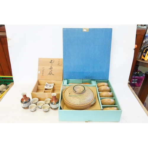 468 - A Japanese Kutani Sake Set decorated with various verses in a Hand made Cedar Box with Characters & ... 