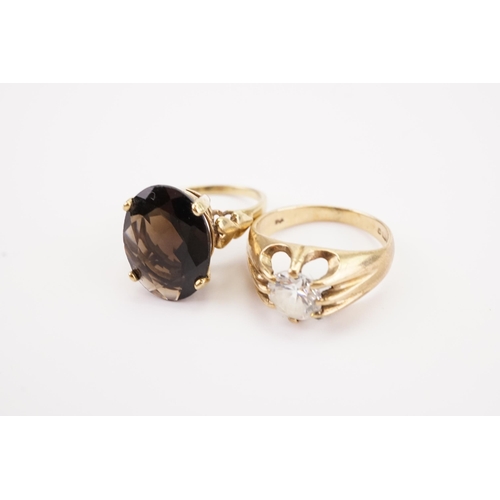 180 - Two 9ct gold dress rings, including a paste set ring and a smoky quartz. Weight 7.2g.