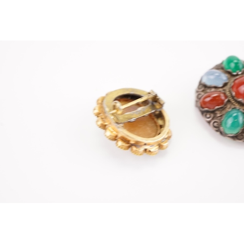 184 - A turquoise and cameo set converted brooch, along with a Scottish pebble design brooch.