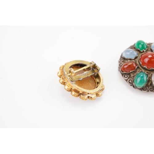 184 - A turquoise and cameo set converted brooch, along with a Scottish pebble design brooch.