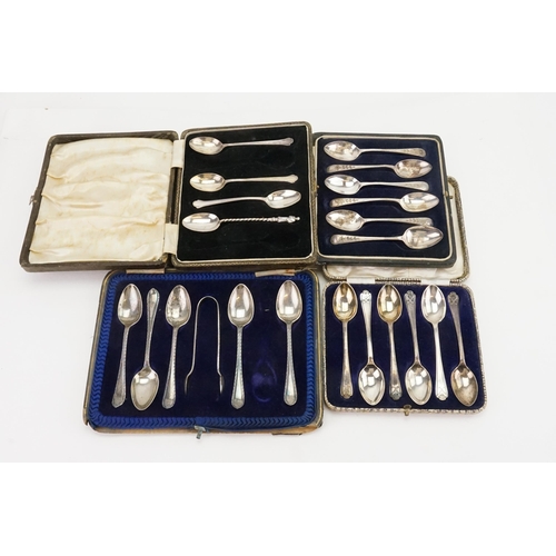 63 - Cased silver sets of spoons and tongs. Total silver weight 274g.