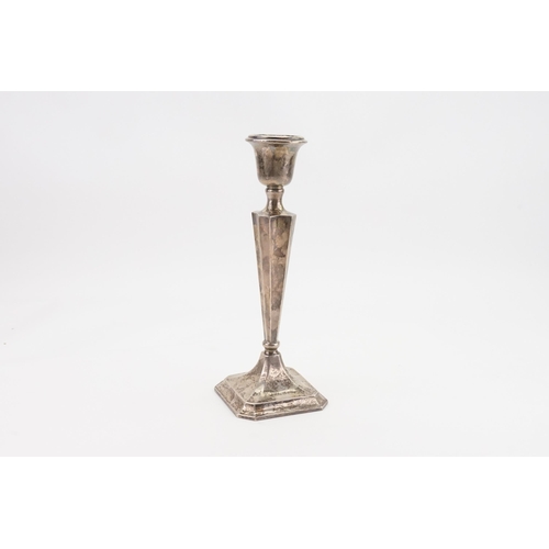 65 - A 1912 Edwardian Birmingham silver candlestick holder. Weighted. Height 26cm.