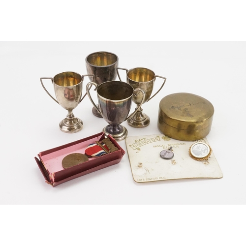 68 - A collection of silver trophy cups, along with one other. Weight 64g. Along with various other items... 