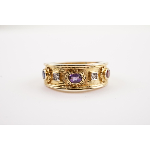 191 - A Brooks & Bentley Golden Jubilee 9ct gold ring in presentation box. Set with Garnets, Sapphires and... 