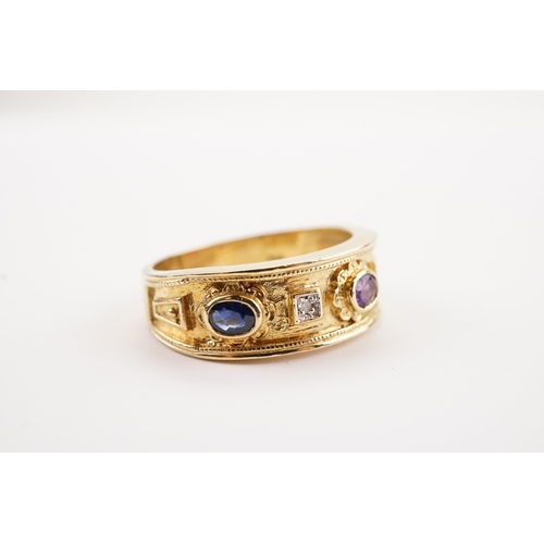 191 - A Brooks & Bentley Golden Jubilee 9ct gold ring in presentation box. Set with Garnets, Sapphires and... 