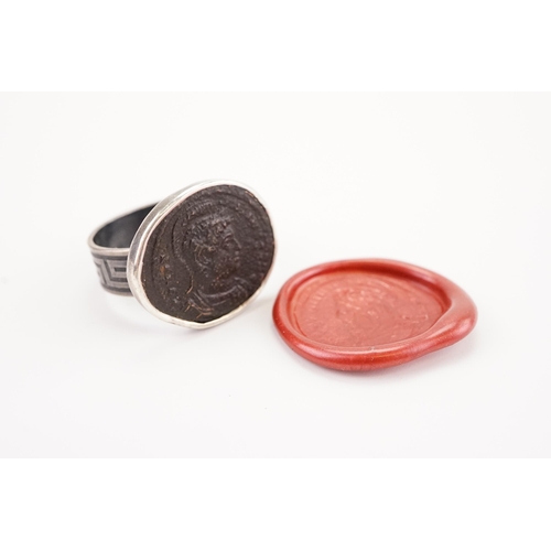 233 - A interesting intaglio set ring, depicting a ancient Roman bust and script.