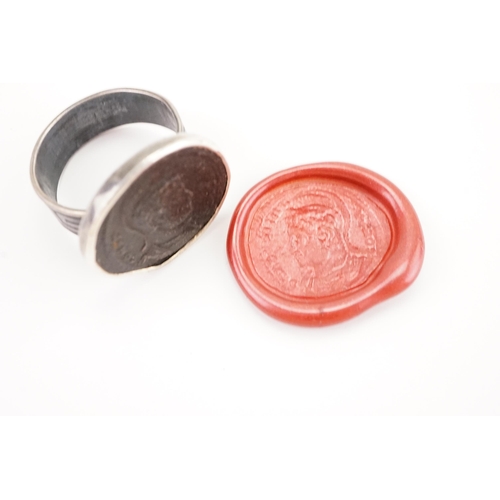 233 - A interesting intaglio set ring, depicting a ancient Roman bust and script.