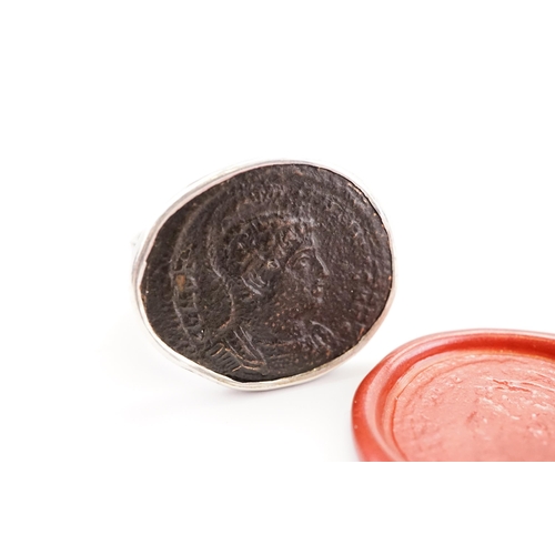 233 - A interesting intaglio set ring, depicting a ancient Roman bust and script.