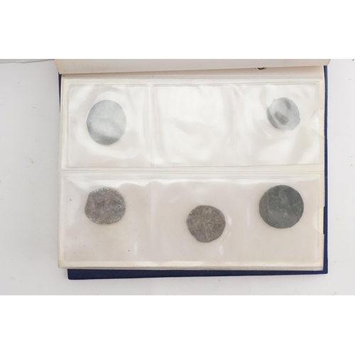 285 - A pocket album containing various world coins, English, Spanish, Roman etc.