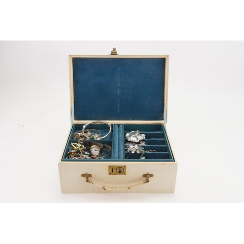 237 - A box containing silver and costume jewellery, including brooches, earrings etc.