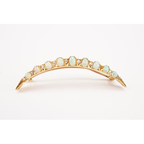 196 - A 9ct gold Victorian opal and paste set moon brooch, set with 9 opals.