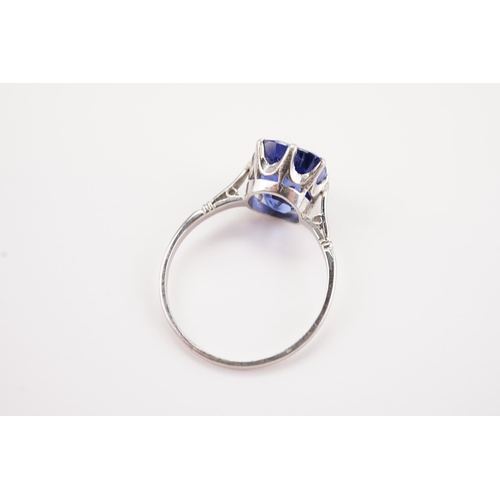 209 - A large synthetic sapphire set ring, in a platinum mount. Sapphire size approx 3ct. 9.3 x 10.2 x 7.5... 