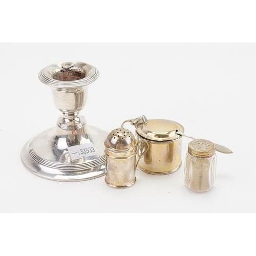 57 - A silver candlestick holder, along with a part cruet.