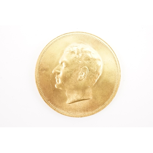 288 - A 1970's Iranian gold medal celebrating the 2500 years of empire, depicting Mohammad Reza Shah Pahla... 