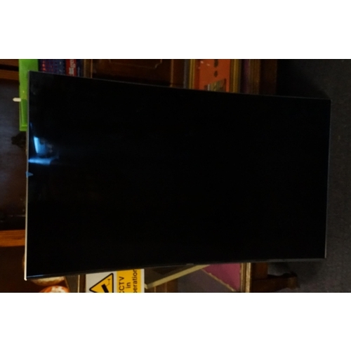 536 - A Samsung Curved 49inch TV with Wall Bracket.