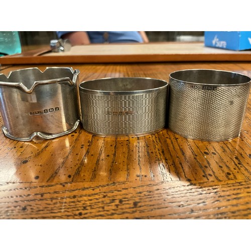 12 - A Silver Engine Turned design Ashtray along with Three Silver Napkin Rings & a Silver Weighted Stem ... 