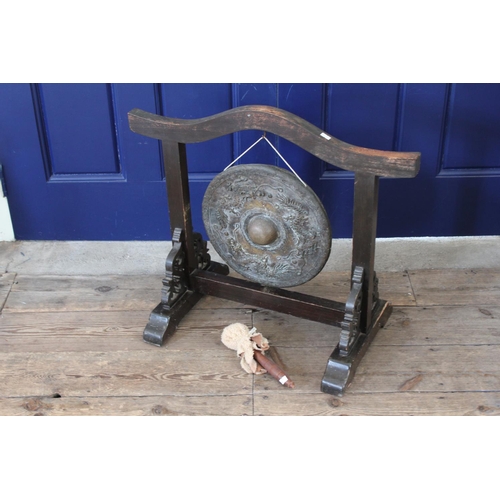 321 - A late 19th Century Table Gong decorated with Dragons. Measuring: 70cms across x 60cms high.