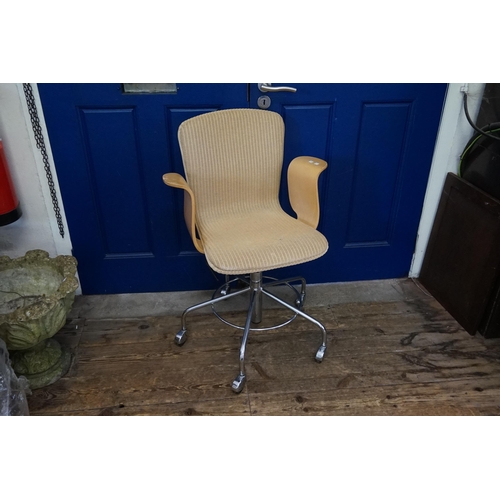 509 - A Lloyd Loom Swivel Base Steamed Plywood armed Office Chair resting on Five Legs & Castors. Silver P... 